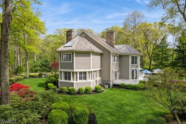 2 Queens Ct, Mendham Twp, NJ 07960 - back of property featuring a chimney, a yard, and a wooden deck
