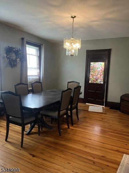 4 Municipal Dr, Pohatcong Twp, NJ 08865 - dining space with light wood-type flooring and a notable chandelier