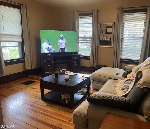 4 Municipal Dr, Pohatcong Twp, NJ 08865 - living room featuring a healthy amount of sunlight, wood-type flooring, and visible vents