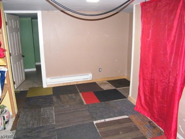 interior space featuring baseboards and baseboard heating