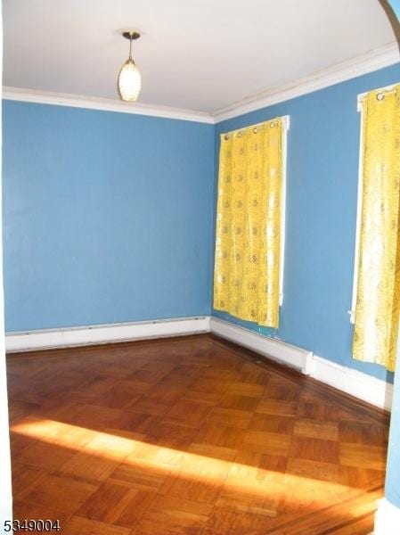 unfurnished room with baseboards, a baseboard heating unit, and ornamental molding