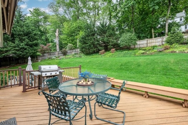84 Burnham Pkwy, Morris Twp, NJ 07960 - wooden deck featuring a fenced backyard, view of wooded area, grilling area, and outdoor dining area