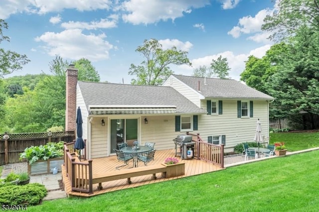 84 Burnham Pkwy, Morris Twp, NJ 07960 - rear view of house featuring a chimney, a wooden deck, outdoor dining area, and a shingled roof