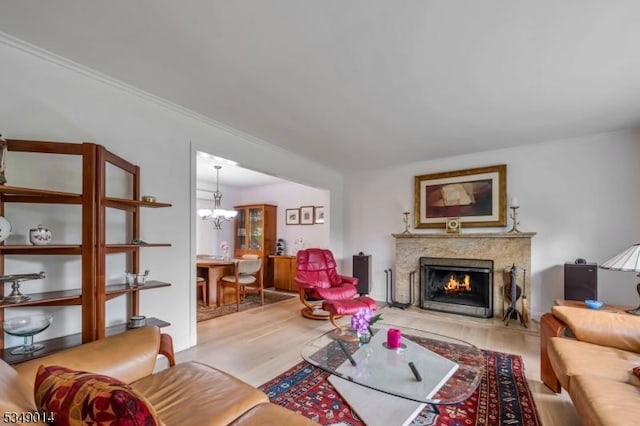 84 Burnham Pkwy, Morris Twp, NJ 07960 - living room featuring a premium fireplace, a chandelier, and wood finished floors