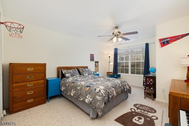bedroom featuring baseboards, light carpet, and a ceiling fan