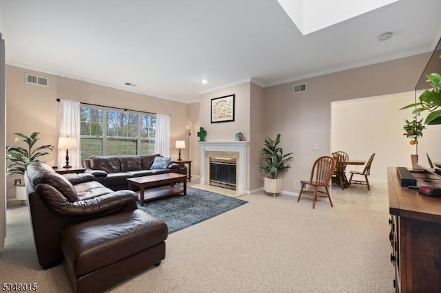 living room featuring crown molding, light carpet, a fireplace with flush hearth, and visible vents