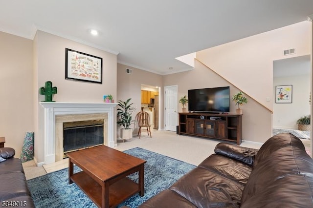 living area with ornamental molding, a fireplace, recessed lighting, and visible vents