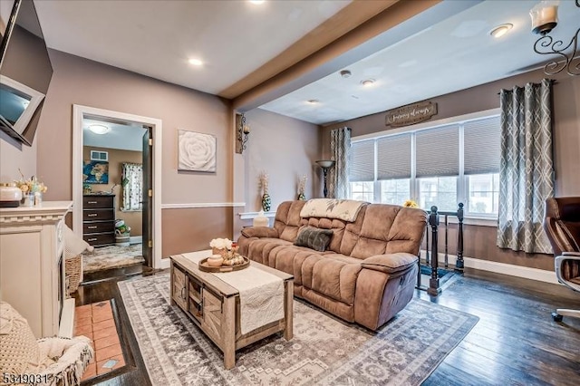 living room with recessed lighting, visible vents, hardwood / wood-style flooring, and baseboards