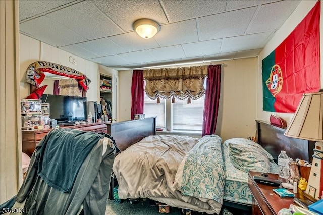 bedroom with a drop ceiling