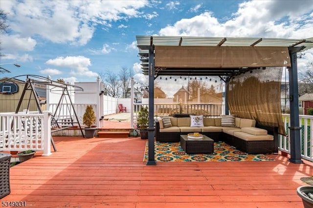 wooden deck with an outdoor living space, fence, and a pergola
