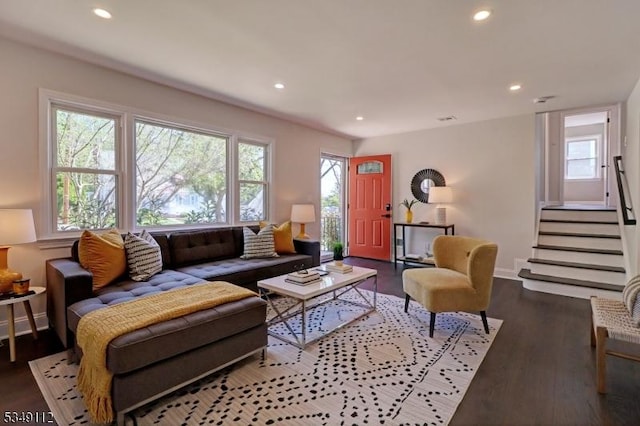 living area with stairs, recessed lighting, baseboards, and wood finished floors