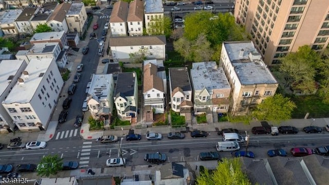 birds eye view of property with a residential view