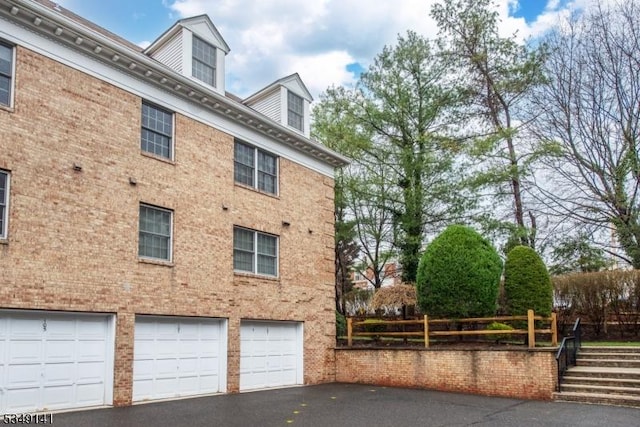 107 S Maple, Park Ridge Boro, NJ 07656 - view of property exterior with a garage and driveway