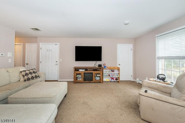107 S Maple, Park Ridge Boro, NJ 07656 - living room with light carpet, baseboards, visible vents, and a baseboard radiator