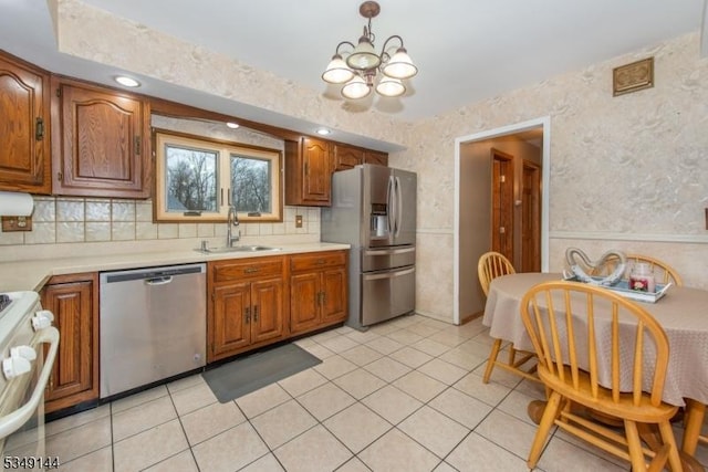 11 Stillwell Rd, South Brunswick Twp, NJ 08824 - kitchen featuring stainless steel appliances, a sink, a chandelier, and light countertops