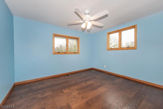 11 Stillwell Rd, South Brunswick Twp, NJ 08824 - unfurnished room featuring dark wood-style floors, plenty of natural light, baseboards, and a ceiling fan
