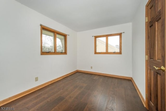11 Stillwell Rd, South Brunswick Twp, NJ 08824 - unfurnished room with healthy amount of natural light, baseboards, and dark wood-style flooring