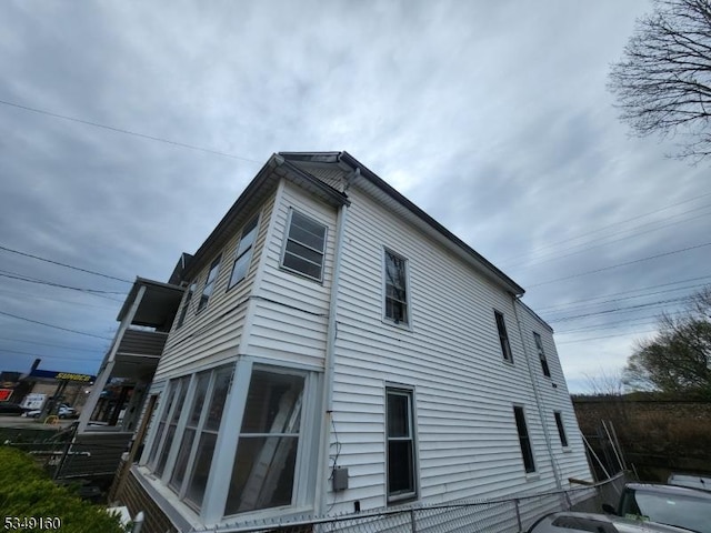 view of property exterior with fence