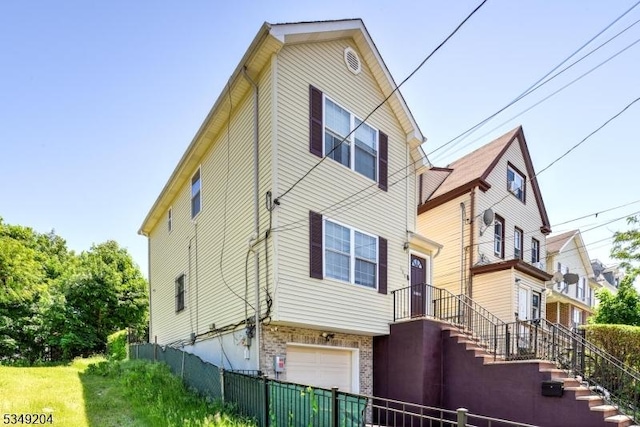 688 S 18th St, Newark City, NJ 07103 - view of property exterior featuring a garage
