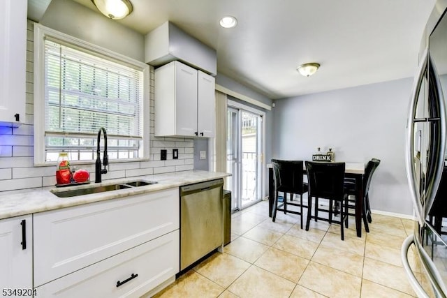 688 S 18th St, Newark City, NJ 07103 - kitchen featuring stainless steel appliances, a sink, tasteful backsplash, white cabinets, and recessed lighting