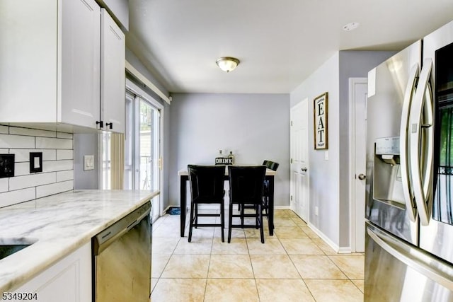 688 S 18th St, Newark City, NJ 07103 - dining room featuring light tile patterned floors and baseboards