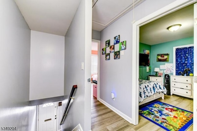 688 S 18th St, Newark City, NJ 07103 - bedroom with attic access, wood finished floors, and baseboards