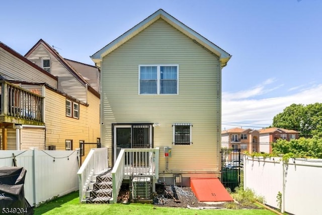 688 S 18th St, Newark City, NJ 07103 - back of property with a wooden deck and central AC unit