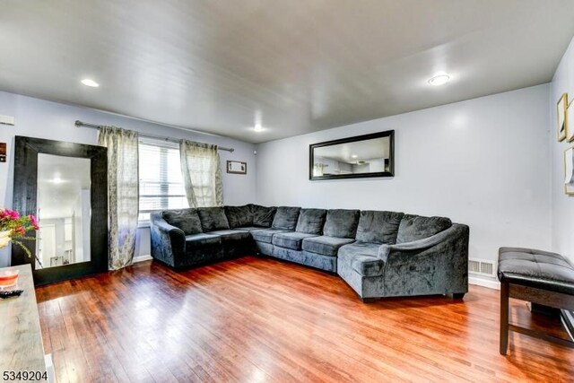688 S 18th St, Newark City, NJ 07103 - living room featuring wood finished floors and baseboards