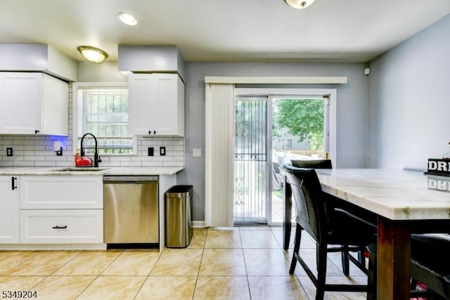 688 S 18th St, Newark City, NJ 07103 - kitchen with dishwasher, a sink, and white cabinets