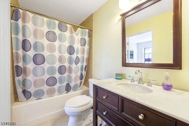 full bathroom featuring vanity, shower / bath combo, and toilet