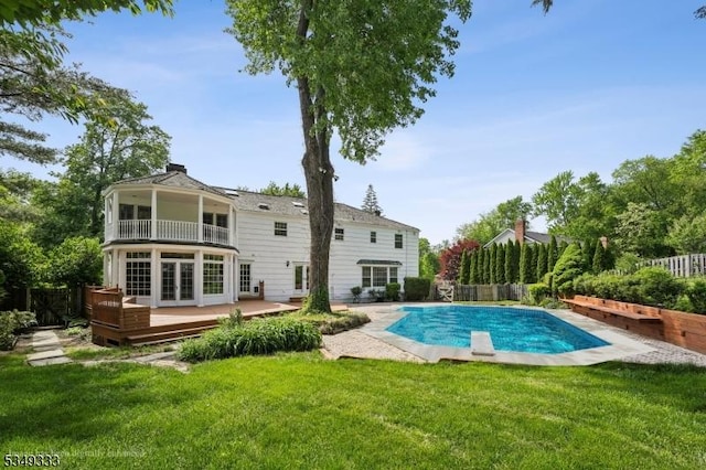 view of pool with a deck and french doors