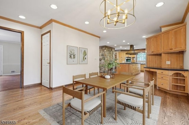 dining area with crown molding, light wood-type flooring, recessed lighting, a chandelier, and baseboards