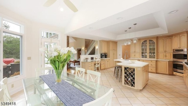 24 Glenview Dr, Warren Twp, NJ 07059 - kitchen featuring stainless steel double oven, light brown cabinets, light countertops, glass insert cabinets, and an island with sink