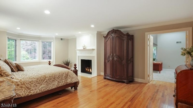 24 Glenview Dr, Warren Twp, NJ 07059 - bedroom featuring ornamental molding, light wood-style flooring, recessed lighting, baseboards, and a fireplace