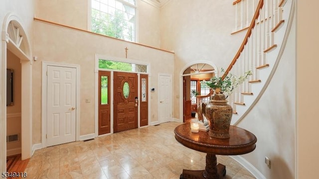 24 Glenview Dr, Warren Twp, NJ 07059 - foyer entrance with a towering ceiling, stairway, baseboards, and ornamental molding