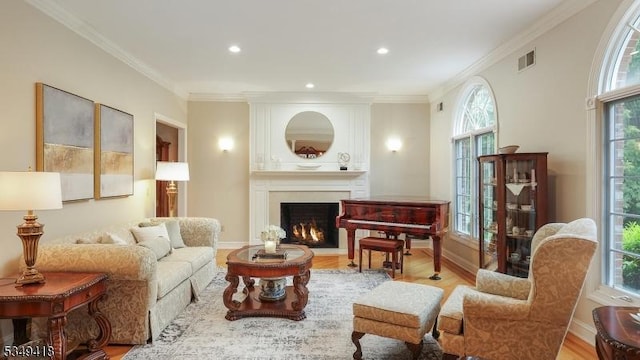 24 Glenview Dr, Warren Twp, NJ 07059 - living room with wood finished floors, healthy amount of natural light, a large fireplace, crown molding, and recessed lighting