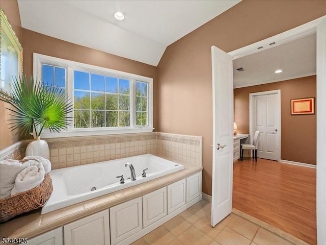 full bath with tile patterned flooring, vaulted ceiling, baseboards, a whirlpool tub, and recessed lighting