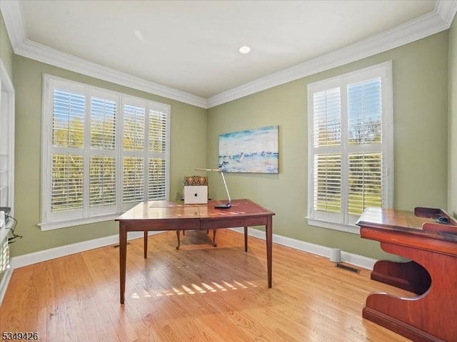 office area with ornamental molding and a wealth of natural light