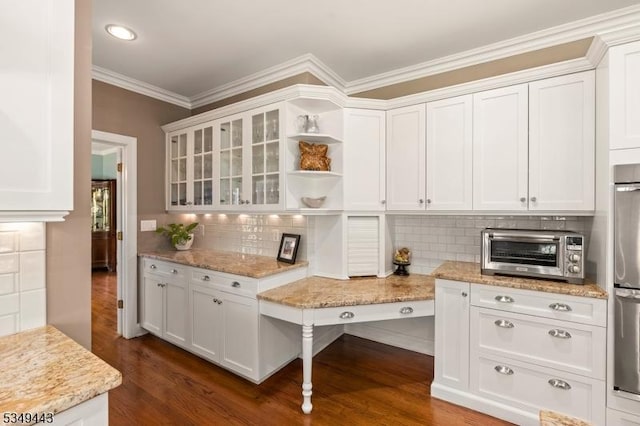 kitchen with open shelves, white cabinets, ornamental molding, decorative backsplash, and glass insert cabinets