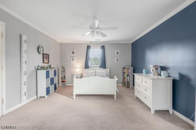 bedroom featuring light colored carpet, baseboards, and crown molding