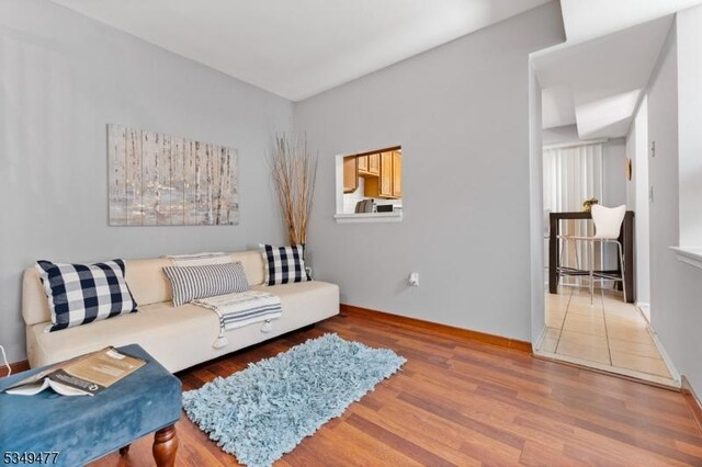 living room with wood finished floors and baseboards