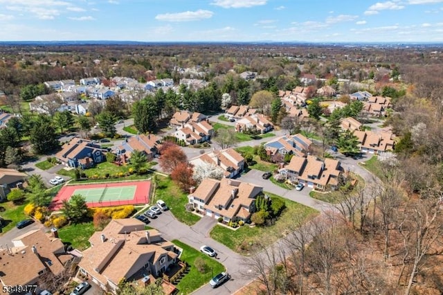 birds eye view of property with a residential view