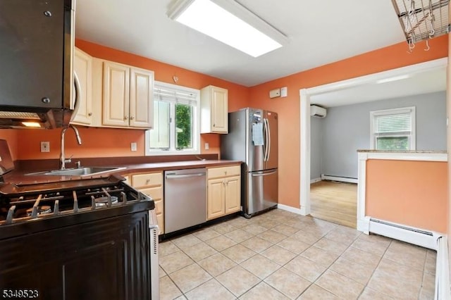 59 James St, Morristown Town, NJ 07960 - kitchen featuring appliances with stainless steel finishes, baseboard heating, and healthy amount of natural light