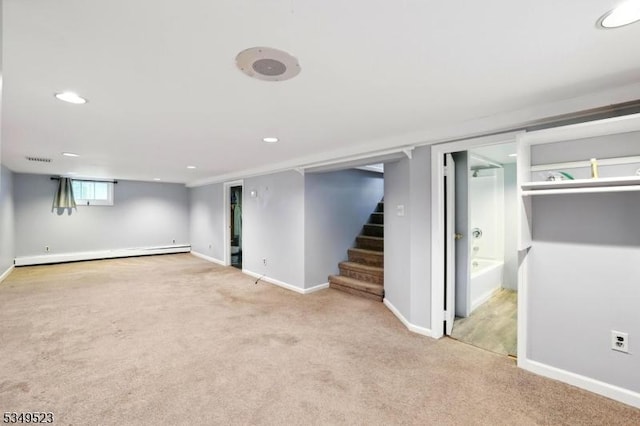 59 James St, Morristown Town, NJ 07960 - basement with carpet floors, a baseboard radiator, stairs, and recessed lighting