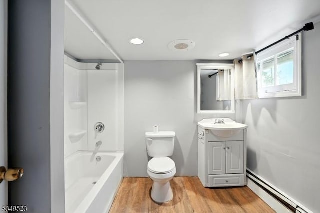 59 James St, Morristown Town, NJ 07960 - bathroom with a baseboard radiator, vanity, wood finished floors, and bathing tub / shower combination