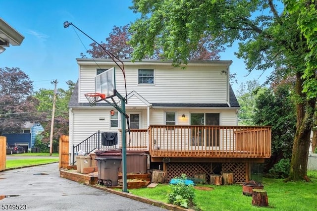 59 James St, Morristown Town, NJ 07960 - rear view of property with a hot tub, a deck, and a lawn