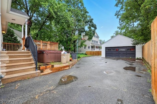 59 James St, Morristown Town, NJ 07960 - exterior space featuring a hot tub, a garage, and an outbuilding