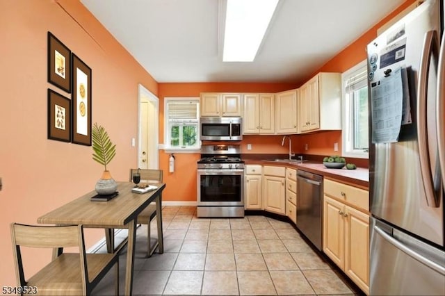 59 James St, Morristown Town, NJ 07960 - kitchen with appliances with stainless steel finishes, healthy amount of natural light, and light tile patterned floors