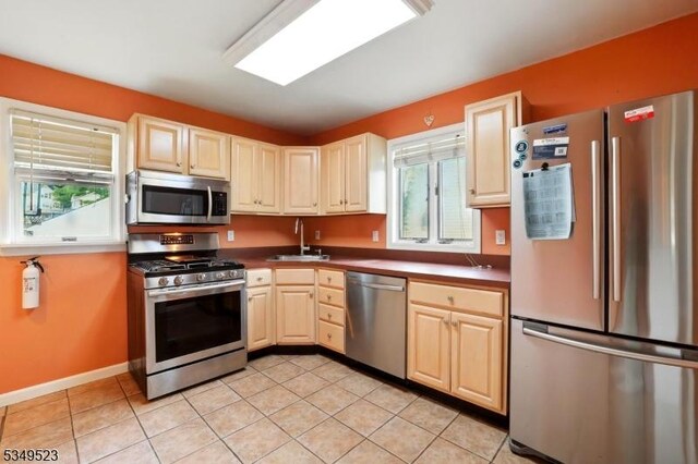 59 James St, Morristown Town, NJ 07960 - kitchen featuring stainless steel appliances, light tile patterned floors, and dark countertops