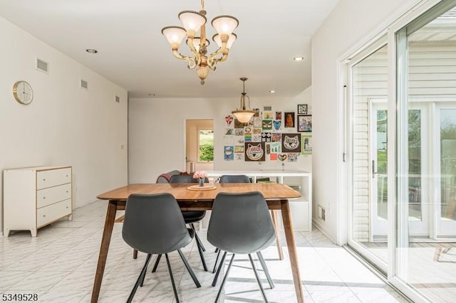 dining room with a chandelier and recessed lighting